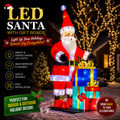Commercial Holiday Lighting Solutions Giant 3D LED Santa Claus with Stacked Gift Boxes | Large Silk Motif Landmark