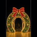 Giant 3D Christmas wreath LED motif light walk-through archway for commercial decorations.
