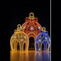 Giant 3D Christmas bauble LED motif light walk-through pavilion with red gold and blue ornament balls for commercial shopping mall decoration.